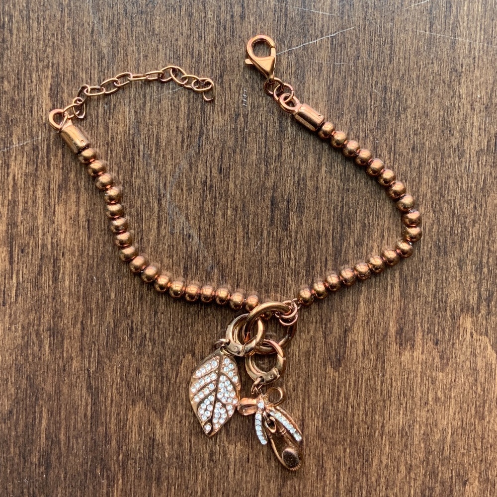 FOSSIL Charm Bracelet copper toned with 2 charms.